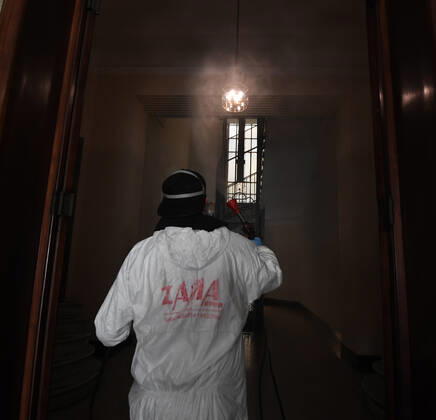 (200427) -- ROME, April 27, 2020 (Xinhua) -- A worker of a disinfection company disinfects a residential building amid the coronavirus pandemic in Rome, Italy, April 27, 2020. (Photo by Alberto Lingria Xinhua) ITALY-ROME-COVID-19-DISINFECTION 