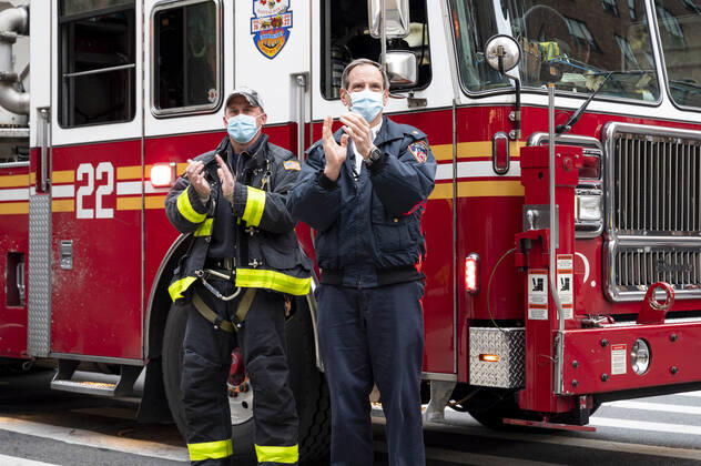 April 27, 2020, New York, NY, U.S: April 27, 2020 - New York, NY, United States: New York City Firemen at the corner of West 113th Street and Amsterdam Avenue clapping and cheering at 7:00pm for frontline and essential workers facing the Coronavirus. New York U.S. - ZUMAb161 20200427_zap_b161_009 Copyright: xMichaelxBrochsteinx