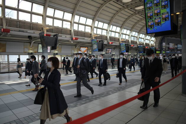 TOKYO, JAPAN - APRIL 28: Commuters wearing face mask head to work during a rush hour in Tokyo amid concerns of the COVID-19 coronavirus outbreak on Tuesday, April 28, 2020. Japanese Prime Minister Shinzo Abe declared a nationwide State of Emergency last week urging people to stay home to prevent the spread of the coronavirus throughout the country. (Photo: Richard Atrero de Guzman AFLO) (125774062)