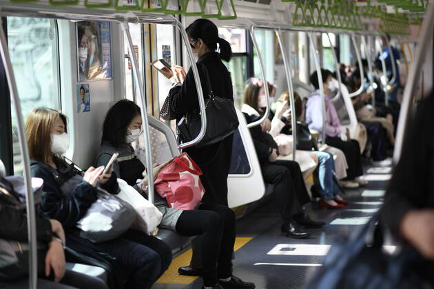 TOKYO, JAPAN - APRIL 28: Commuters wearing face mask head to work during a rush hour in Tokyo amid concerns of the COVID-19 coronavirus outbreak on Tuesday, April 28, 2020. Japanese Prime Minister Shinzo Abe declared a nationwide State of Emergency last week urging people to stay home to prevent the spread of the coronavirus throughout the country. (Photo: Richard Atrero de Guzman AFLO) (125774077)