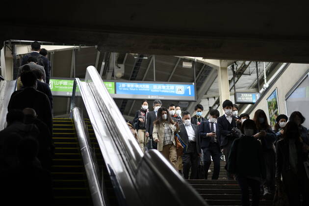 TOKYO, JAPAN - APRIL 28: Commuters wearing face mask head to work during a rush hour in Tokyo amid concerns of the COVID-19 coronavirus outbreak on Tuesday, April 28, 2020. Japanese Prime Minister Shinzo Abe declared a nationwide State of Emergency last week urging people to stay home to prevent the spread of the coronavirus throughout the country. (Photo: Richard Atrero de Guzman AFLO) (125774078)