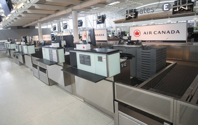 (200427) -- TORONTO, April 27, 2020 -- Photo taken on April 27, 2020 shows check-in counters of Air Canada at Pearson International Airport in Toronto, Canada. Air Canada suspended all scheduled flights to the United States for four weeks starting on Monday. As of Monday afternoon, there were 48,230 confirmed COVID-19 cases in Canada and 2,701 deaths. (Photo by Xinhua) CANADA-TORONTO-COVID-19-AIR CANADA-FLIGHTS TO U.S.-SUSPENSION ZouxZheng 