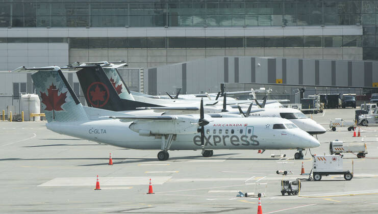 (200427) -- TORONTO, April 27, 2020 -- Planes of Air Canada are seen at Pearson International Airport in Toronto, Canada, April 27, 2020. Air Canada suspended all scheduled flights to the United States for four weeks starting on Monday. As of Monday afternoon, there were 48,230 confirmed COVID-19 cases in Canada and 2,701 deaths. (Photo by Xinhua) CANADA-TORONTO-COVID-19-AIR CANADA-FLIGHTS TO U.S.-SUSPENSION ZouxZheng 