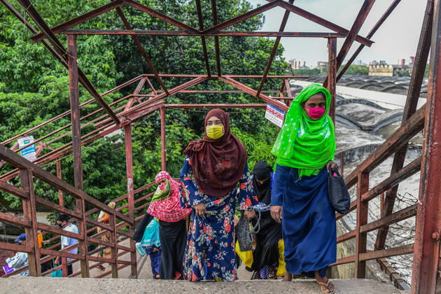 April 27, 2020, Dhaka, Bangladesh: Garment workers are seen leaving the factory after their shift. .This is the scenario after factories reopen during the nationwide lockdown that was imposed by the government in attempt to reduce the spread of COVID-19 coronavirus pandemic in Dhaka. Dhaka Bangladesh - ZUMAs197 20200427_zaa_s197_200 Copyright: xZabedxHasnainxChowdhuryx