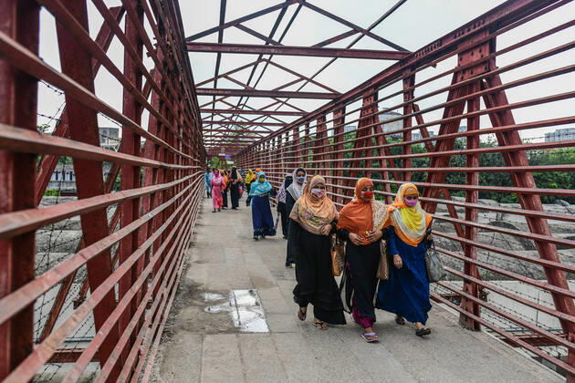 April 27, 2020, Dhaka, Bangladesh: Garment workers are seen leaving the factory after their shift. .This is the scenario after factories reopen during the nationwide lockdown that was imposed by the government in attempt to reduce the spread of COVID-19 coronavirus pandemic in Dhaka. Dhaka Bangladesh - ZUMAs197 20200427_zaa_s197_208 Copyright: xZabedxHasnainxChowdhuryx