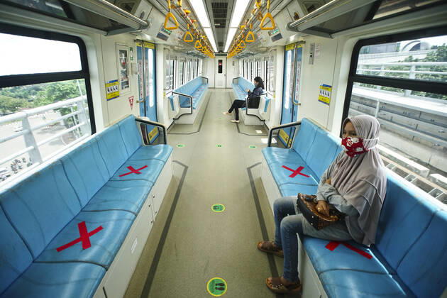 April 28, 2020, Palembang, South Sumatra, Indonesia: April 28, 2020 : Palembang,South Sumatra, Indonesia : People sit on designated areas decided by red cross marks to ensure social distancing inside a light rapid transit train in Palembang, South Sumatra on April 28, 2020.The Indonesian government has closed mall , tourists destinations and urged citizens to avoid public gatherings, including religious activities as a precautionary measure against the spread of coronavirus. Zuma Wire Palembang Indonesia - ZUMAz115 20200428_zip_z115_007 Copyright: xALxZulkiflix