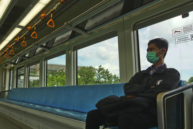 April 28, 2020, Palembang, South Sumatra, Indonesia: April 28, 2020 : Palembang,South Sumatra, Indonesia : People sit on designated areas decided by red cross marks to ensure social distancing inside a light rapid transit train in Palembang, South Sumatra on April 28, 2020.The Indonesian government has closed mall , tourists destinations and urged citizens to avoid public gatherings, including religious activities as a precautionary measure against the spread of coronavirus. Zuma Wire Palembang Indonesia - ZUMAz115 20200428_zip_z115_014 Copyright: xALxZulkiflix