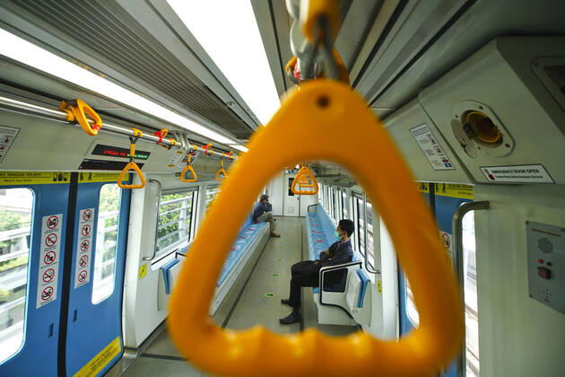 April 28, 2020, Palembang, South Sumatra, Indonesia: April 28, 2020 : Palembang,South Sumatra, Indonesia : People sit on designated areas decided by red cross marks to ensure social distancing inside a light rapid transit train in Palembang, South Sumatra on April 28, 2020.The Indonesian government has closed mall , tourists destinations and urged citizens to avoid public gatherings, including religious activities as a precautionary measure against the spread of coronavirus. Zuma Wire Palembang Indonesia - ZUMAz115 20200428_zip_z115_015 Copyright: xALxZulkiflix