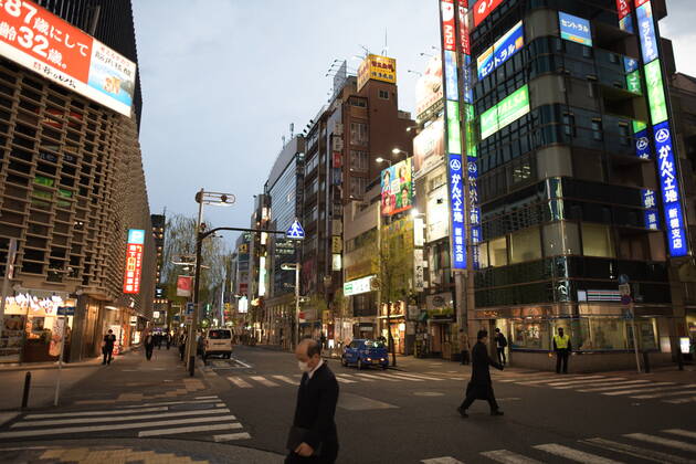 TOKYO, JAPAN - APRIL 28: Commuters which is less than normal is seen head back home after work in Tokyo s financial district amid concerns of the COVID-19 coronavirus outbreak on Tuesday, April 28, 2020. Japanese Prime Minister Shinzo Abe declared a nationwide State of Emergency last week urging people to stay home to prevent the spread of the coronavirus throughout the country. (Photo: Richard Atrero de Guzman AFLO) (125786463)