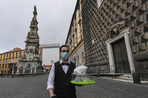 Bartender is on his way to deliver coffee in Naples, after the lockdown due to Government Decree declaring all of Italy a protected area to combat Covid-19 - Coronavirus infection. A new Government Decree has established rules for gradually reopening economic and social activities from today.  Copyright: xSalvatorexLaporta KONTROLABx xIPx xx