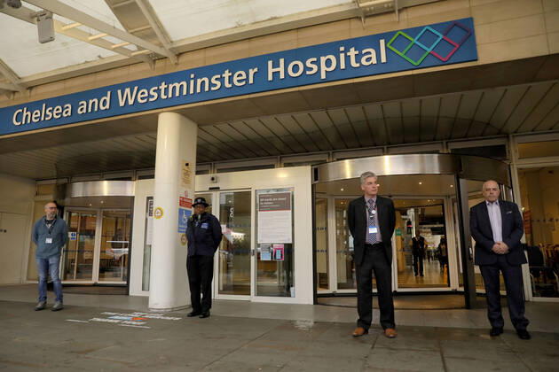 (200428) -- LONDON, April 28, 2020 (Xinhua) -- People take part in one minute s silence outside Chelsea and Westminster Hospital in London, Britain on April 28, 2020. One minute s silence was held across Britain Tuesday morning to commemorate the key workers who have died during the novel coronavirus outbreak. (Photo by Tim Ireland Xinhua) BRITAIN-LONDON-COVID-19-COMMEMORATION 