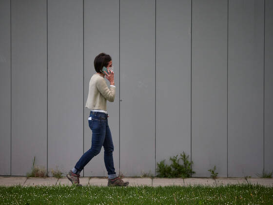 April 28, 2020, Pamplona, NAVARRA, SPAIN: A woman walks talking on the mobile phone in the Navarra Hospital Complex during a Covid-19 Pandemic on April 28, 2020 in Pamplona, Navarra, Spain Pamplona SPAIN - ZUMAa181 20200428_zaa_a181_047 Copyright: xEduardoxSanzx