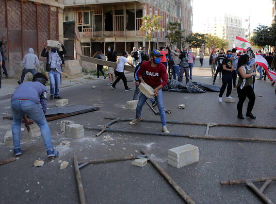 April 28, 2020, Beirut, Beirut, Lebanon: Lebanese protesters Anti-government throw pieces of concrete during a protest against growing economic hardship in Beirut, Lebanon April 28, 2020. Hundreds of protesters in Lebanon s northern city of Tripoli set fire to two banks and hurled stones at soldiers, who responded with tear gas and batons in renewed clashes triggered by an economic crisis spiraling out of control amid a weeks-long virus lockdown Beirut Lebanon - ZUMAap3_ 20200428_zaf_ap3_146 Copyright: xMarwanxBouxHaidarx
