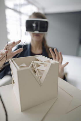 Woman with architectural model wearing VR glasses model released Symbolfoto property released GUSF03510