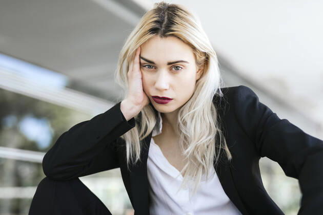 Creative Highlights Symbolfotos Portrait of young businesswoman with dyed blond hair wearing black pantsuit model released Symbolfoto TCEF00579