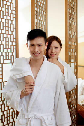 A couple enjoying life in a hotel room 55295075424536051