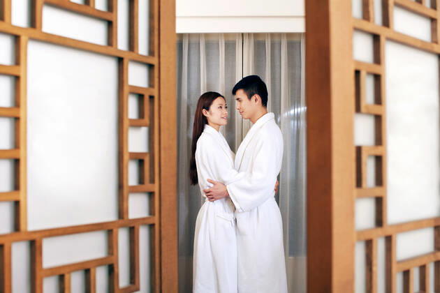 A couple enjoying life in a hotel room 55295075424537249