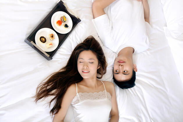 A couple enjoying life in a hotel room 55295075424537398