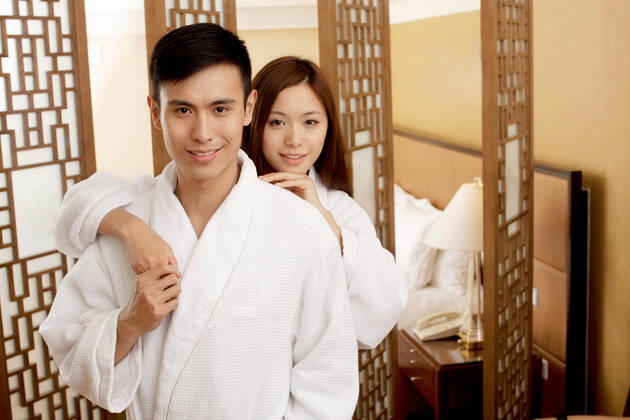 A couple enjoying life in a hotel room 55295075424538709