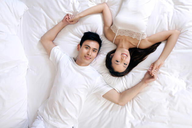 A couple enjoying life in a hotel room 55295075424538740