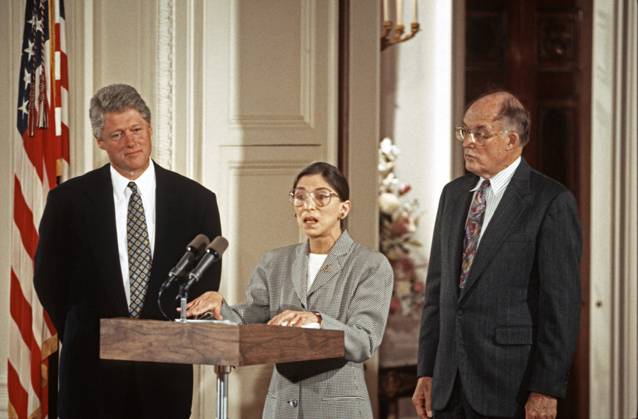 IMAGO ICONS: Ruth Bader Ginsburg August 10, 1993, Washington, District of Columbia, USA: Associate Justice of the Supreme Court Ruth Bader Ginsburg, center, makes remarks prior to taking the oath of office during a swearing-in ceremony in the East Room of the White House in Washington, DC on August 10, 1993. Looking on are United States President Bill Clinton, left, and Chief Justice of the United States William H. Rehnquist, right. Justice Ginsburg replaces Associate Justice Byron R. White Washington USA - ZUMAs152 19930810_zaa_s152_010 Copyright: xArniexSachsx
