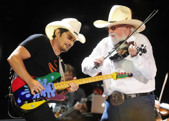 06 July 2020 - Country music and southern rock legend Charlie Daniels has passed away after suffering a stroke. The Grand Ole Opry member and Country Music Hall of Famer was 83. File Photo: 09 June 2013 - Nashville, Tennessee - Brad Paisley, Charlie Daniels. 2013 CMA Music Festival Nightly Concert held at LP Field. Photo Credit: Mike Strasinger AdMedia 257396 2013-06-09 TN Nashville Etats-Unis  Copyright: xAdMediax STAR_257396_038