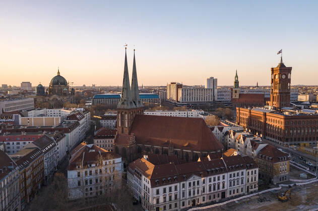 Germany, Berlin, Aerial view of Saint Nicholas Church and surrounding buildings at dusk TAMF02415