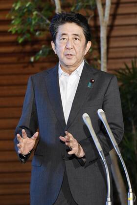 Japan PM Abe Japanese Prime Minister Shinzo Abe speaks to reporters at his office in Tokyo on July 31, 2020.