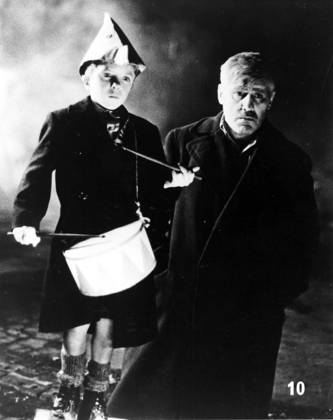 DIE BLECHTROMMEL aka THE TIN DRUM DAVID BENNENT, MARIO ADORF Date: 1979. Strictly editorial use only in conjunction with the promotion of the film. Credit line mandatory. This image is copyright of the film company and is supplied under the terms of issue as film still. No commercial or book cover use permitted without prior consent from the film company. Mandatory credit line: Image courtesy ARGOS FILMS ARTEMIS PRODUCTIONS BIOSKOP FILMS FILM POL Ronald Grant Archive Mary Evans