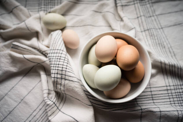 Eggs Nestled in White Bowl on Table at Home Seattle, WA, United States CR_ERWA200901A-479100-01