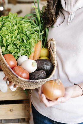 Close-up of vegetable basket held by female customer at store model released Symbolfoto property released RDGF00062