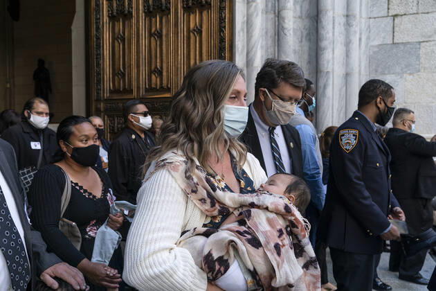 NYPD holds mass for members died of COVID-19 Family members and police officers leave cathedral after NYPD holds mass honoring members died of COVID-19 at St. Patrick s Cathedral. 46 members of NYPD Died during pandemic so far and many of them did not receive proper funeral due to pandemic restrictions. Almost 20% of NYPD members were sick with coronavirus during pick of pandemic in the city. Cardinal Timothy Dolan lead the mass. Mayor Bill de Blasio and Police commissioner Dermot Shea speak. New York New York United States Copyright: LevxRadin