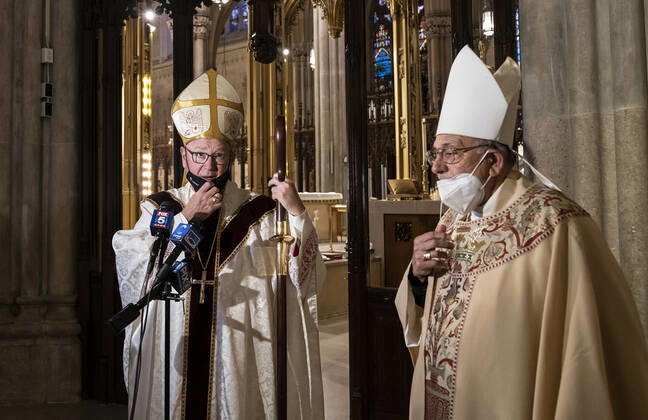 NYPD holds mass for members died of COVID-19 Cardinal Timothy Dolan and Bishop Nicholas DiMarzio seen behind altar speaking to media after the end of NYPD mass honoring members died of COVID-19 at St. Patrick’s Cathedral. 46 members of NYPD Died during pandemic so far and many of them did not receive proper funeral due to pandemic restrictions. Almost 20% of NYPD members were sick with coronavirus during pick of pandemic in the city. Cardinal Timothy Dolan lead the mass. Mayor Bill de Blasio and Police commissioner Dermot Shea speak. New York New York United States Copyright: LevxRadin
