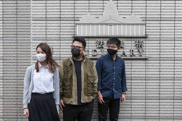 November 23, 2020, Hong Kong, China: Agnes Chow Ting (L), Ivan Lam Long Ying (C), and Joshua Wong Chi-fung (R) arrive at the West Kowloon Law Courts building on November 2020 in Hong Kong, China. The pro-democracy activists Joshua Wong, Ivan Lam and Agnes Chow were taken into custody after they pled guilty to inciting and organizing an unauthorized assembly related to last year protest. Hong Kong China - ZUMAs197 20201123_zaa_s197_169 Copyright: xMiguelxCandelax