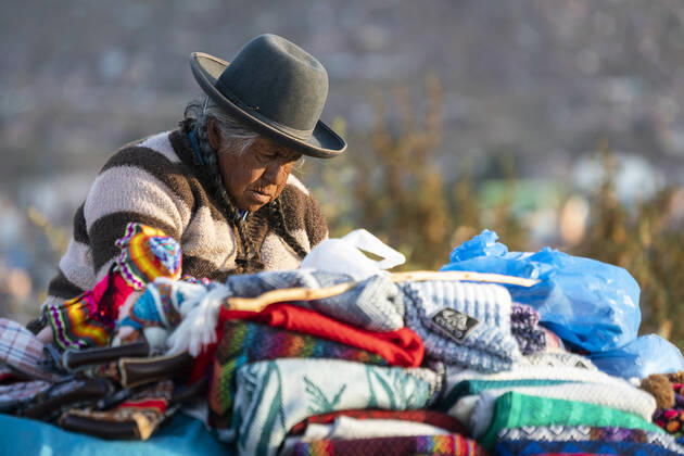 Senior female vendor selling sweaters, Cusco, Peru Cusco, Cusco, Peru CR_FHNX201130A-532736-01 EDITORIAL USE ONLY