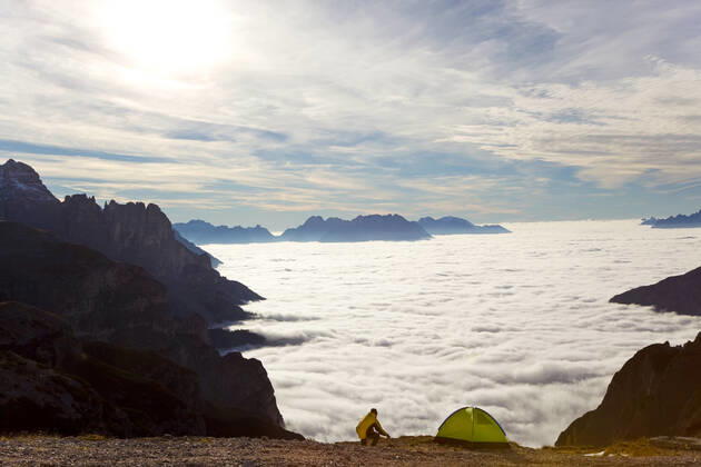 Man and tent above the clouds, Trentino-Alto Adige, South Tyrol in Bolzano district, Alta Pusteria, Hochpustertal,Sexten Dolomites, Italy Man and tent above the clouds, Trentino-Alto Adige, South Tyrol in Bolzano district, Alta Pusteria, Hochpustertal,Sexten Dolomites, Italy Man and tent above the clouds, Trentino-Alto Adige, South Tyrol in Bolzano district, Alta Pusteria, Hochpustertal,Sexten Dolomites, Italy