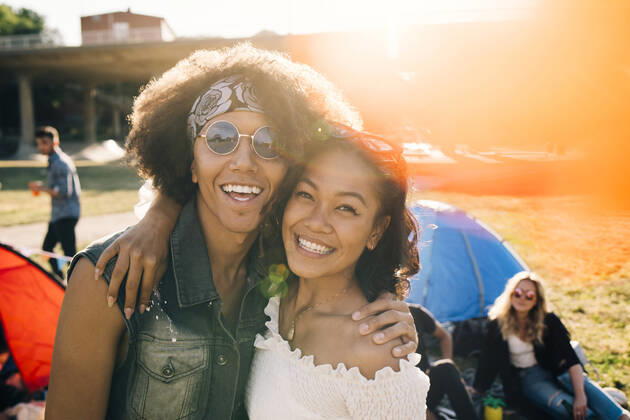 Portrait of smiling friends enjoying at music festival during summer , model released Copyright: xMaskotx , MA69962