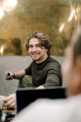 Portrait of smiling business person sitting in office Sweden, Stockholm, model released, property released Copyright: xMaskotx , MA81011