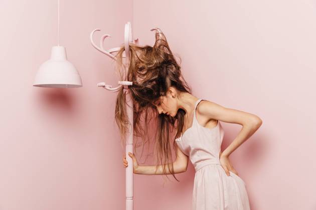 Front view of a teenage girl with tangled hairs on pink background, Model released, Property released Copyright: xMarcosxOsoriox MR
