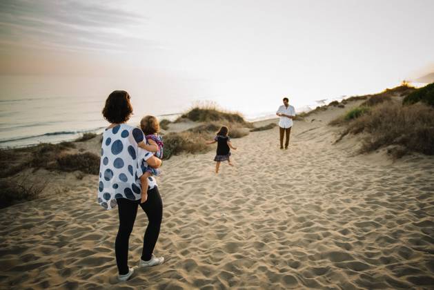 Family walking on beach Copyright: xPatriciaxBecarotox Model Released