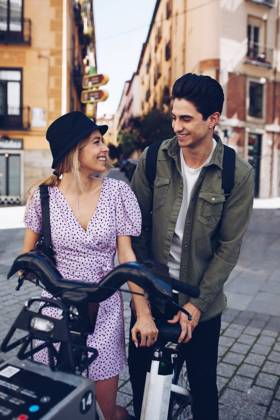 Young cheerful couple in casual clothes having fun during dating outdoors, Model released Copyright: xRamonxLopezx MR