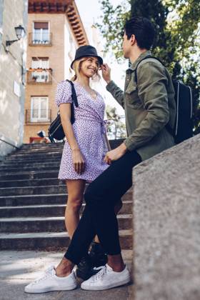 Young cheerful couple in casual clothes having fun during dating outdoors, Model released Copyright: xRamonxLopezx MR