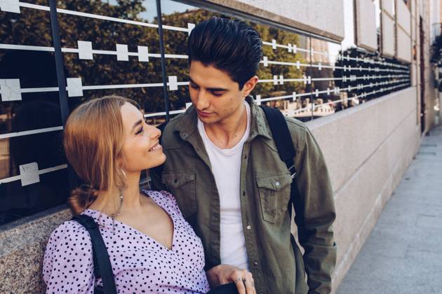 Young cheerful couple in casual clothes having fun during dating outdoors, Model released Copyright: xRamonxLopezx MR