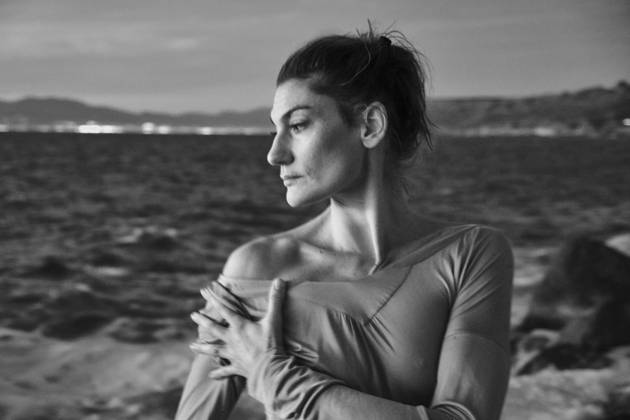 Woman taking off sweater near sea Copyright: xJeroxForradellasx Model Released