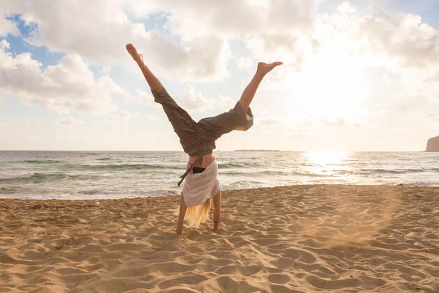 Free Happy Woman Turning Cartwheel Enjoying Sunset on Sandy Beach. Relaxed woman enjoying sun, freedom and life turning cartwheel on beautiful beach in sunset. Young lady feeling free, relaxed and happy. Vacations, freedom, happiness, enjoyment and well being., model releasedbeach, woman, cartwheel, sunset, turn, active, sport, sandy, sporty, summer, female, young, sea, fun, joy, nature, relaxation, sand, girl, person, vacation, sun, beauty, outdoors, water, beautiful, alone, activity, holiday, one, paradise, healthy, happy, lifestyle, natural, sunny, sunshine, travel, ocean, sunlight, attractive, seaside, casual, Falasarna, blond, caucasian, peaceful, traquil, golden hour, turning,