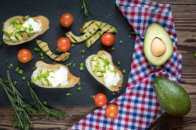 Bread with slices of avocado and cream cheese Bread with slices of grilled avocado and cream cheese on a black cutting stone board. Fresh parsley and rosemary. Vegetarian, vegan concept.avocado, toast, cream, cheese, food, bread, sandwich, green, white, healthy, fruit, meal, vegetable, snack, gourmet, lunch, breakfast, appetizer, delicious, natural, fresh, health, diet, tasty, dinner, vegetarian, slice, eating, tomato, raw, burger, butty, calories, cooking, dark, dietary, dietetic, genetically, organic, seasonal, seeds, spoon, spring, summer, vegan, vegetables, Copyright: xViktoriaxKondysenkox 26168268