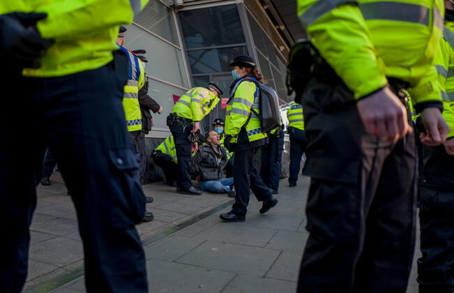 January 9, 2021, London, UK: Metropolitan police officers swarmed Clapham Common in on Saturday after anti-lockdown protesters gathered in the area. Group of demonstrators chanting Ã¢â‚¬oetake your freedom backÃ¢â‚¬Â walked along the high street. Few demonstrators was arrested by Metropolitan Police officers. England s third national lockdown has legally come into force last week. The lockdown means people are able to leave their homes for limited reasons, with measures expected to stay in place until mid-February. London UK - ZUMAg173 20210109_zap_g173_003 Copyright: xVelarxGrantx