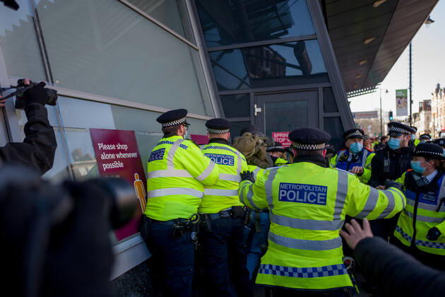 January 9, 2021, London, UK: Metropolitan police officers swarmed Clapham Common in on Saturday after anti-lockdown protesters gathered in the area. Group of demonstrators chanting â€oetake your freedom back†walked along the high street. Few demonstrators was arrested by Metropolitan Police officers. England s third national lockdown has legally come into force last week. The lockdown means people are able to leave their homes for limited reasons, with measures expected to stay in place until mid-February. London UK - ZUMAg173 20210109_zap_g173_013 Copyright: xVelarxGrantx