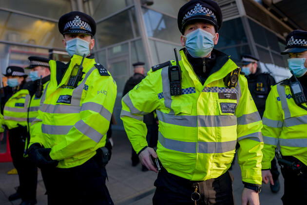 January 9, 2021, London, UK: Metropolitan police officers swarmed Clapham Common in on Saturday after anti-lockdown protesters gathered in the area. Group of demonstrators chanting â€oetake your freedom back†walked along the high street. Few demonstrators was arrested by Metropolitan Police officers. England s third national lockdown has legally come into force last week. The lockdown means people are able to leave their homes for limited reasons, with measures expected to stay in place until mid-February. London UK - ZUMAg173 20210109_zap_g173_014 Copyright: xVelarxGrantx