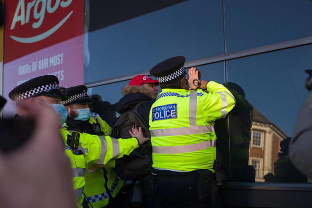 January 9, 2021, London, UK: Metropolitan police officers swarmed Clapham Common in on Saturday after anti-lockdown protesters gathered in the area. Group of demonstrators chanting â€oetake your freedom back†walked along the high street. Few demonstrators was arrested by Metropolitan Police officers. England s third national lockdown has legally come into force last week. The lockdown means people are able to leave their homes for limited reasons, with measures expected to stay in place until mid-February. London UK - ZUMAg173 20210109_zap_g173_018 Copyright: xVelarxGrantx
